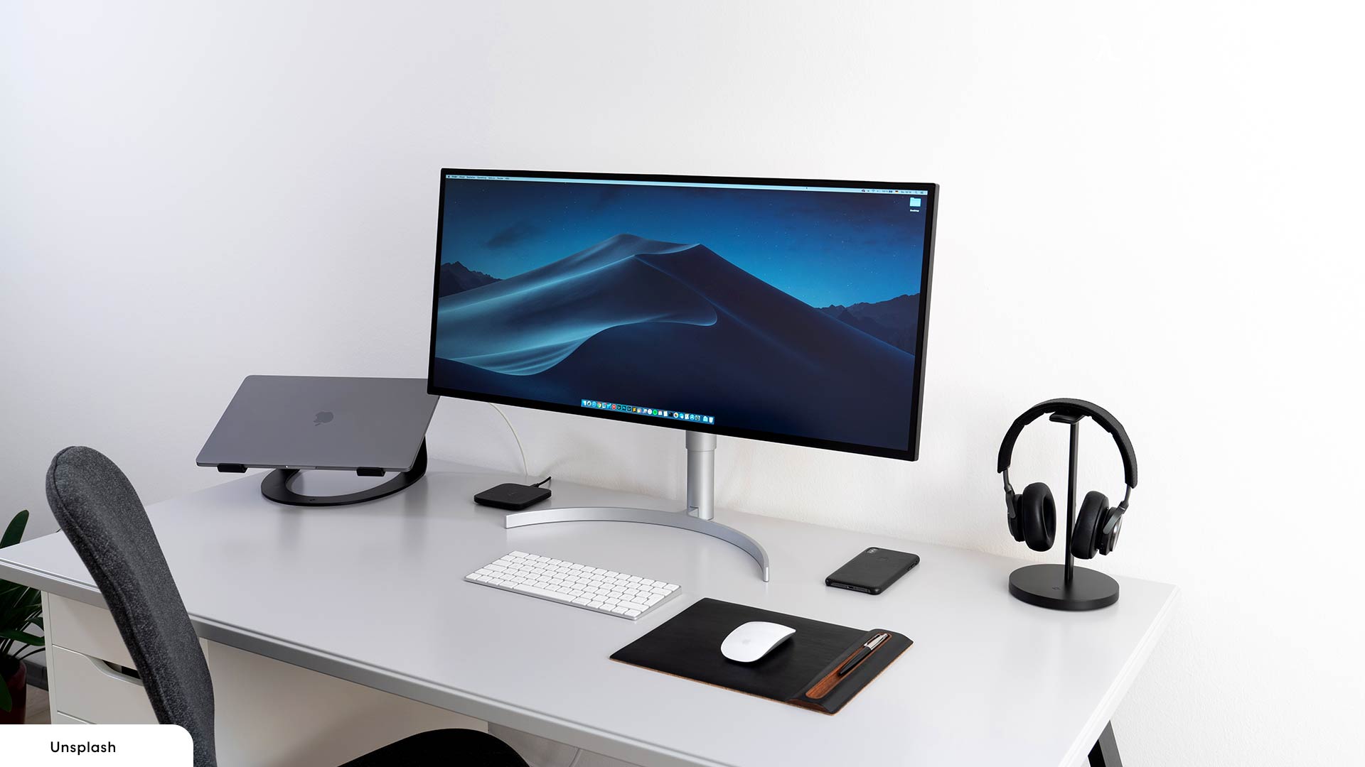 desk setup with laptop and monitor